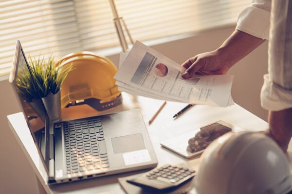 contractor looking at financial statements